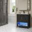 Meuble-lavabo noir, avec lavabo à DEL, portes à fermeture douce et support de rangement.