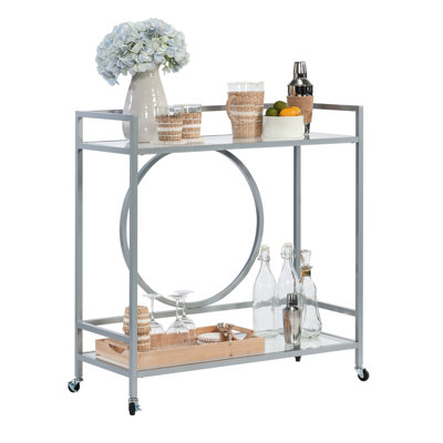Élégant chariot à roulettes contemporain avec finition argentée, deux tablettes en verre, verrouillables pour les espaces de vie et tablettes grises durables pour la cuisine, installation rapide