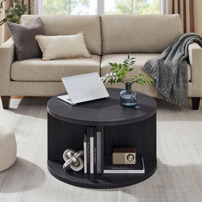 Table basse ronde avec 4 compartiments ouverts pour le rangement