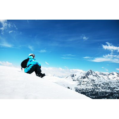 Snowboarder enjoying the nature in mountains