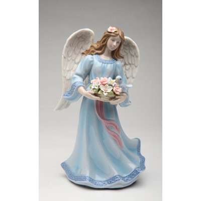 Figurine musicale ange avec panier de fleurs et oiseau