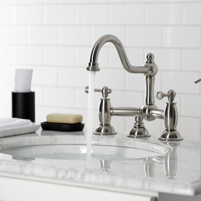 Kingston Brass Restoration Two-Handle 3-Hole Deck Mount Bridge Bathroom Faucet with Brass Pop-Up, Brushed Nickel