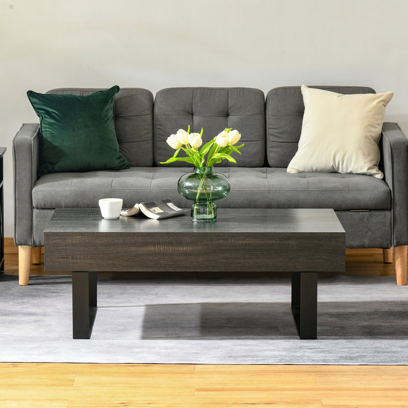 Table gris foncé avec tiroir de rangement agencé de façon créative