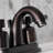 Kingston Brass Kaiser Two-Handle 3-Hole Deck Mount 4" Centerset Bathroom Faucet with Plastic Pop-Up-25314173