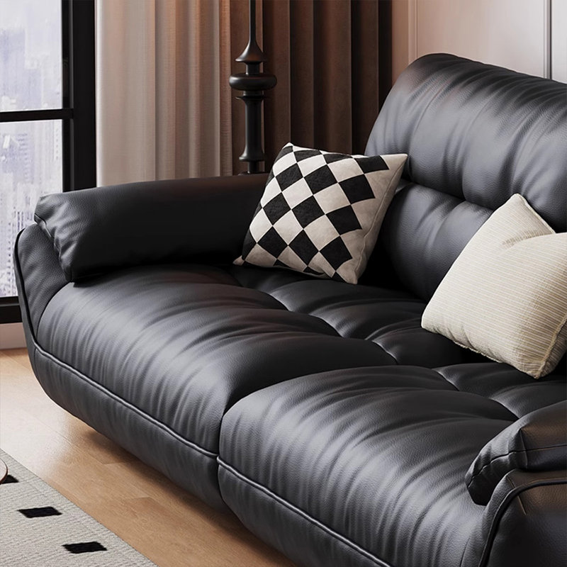 Causeuse-coussin modulable noire en cuir véritable