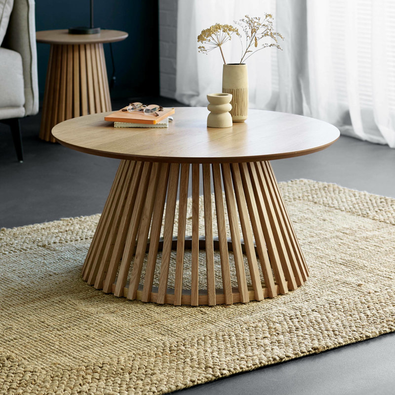 Dejania Pedestal Coffee Table, Natural Wood