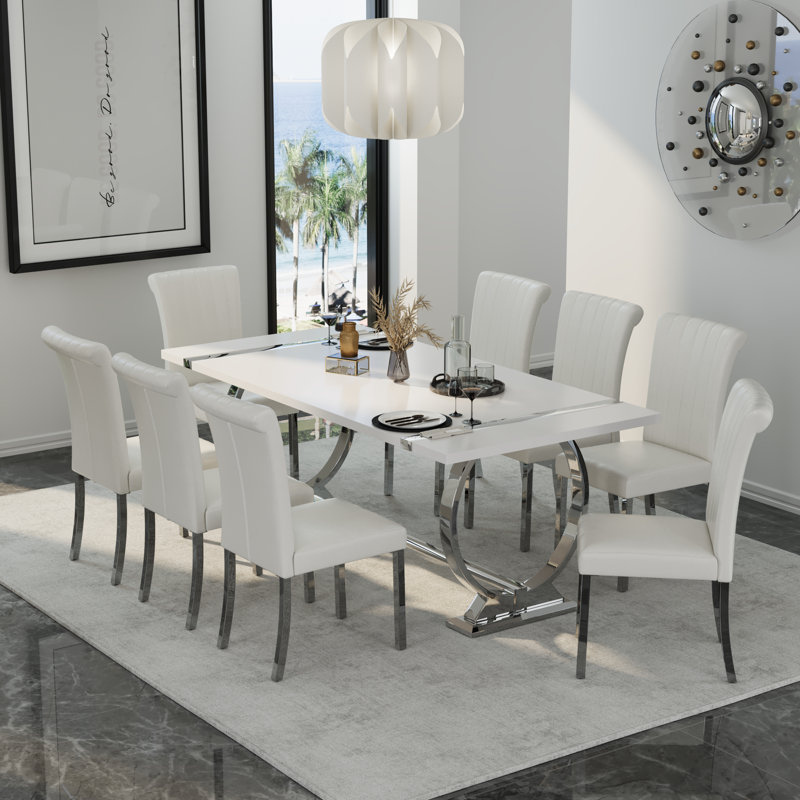 Ensemble de 4 chaises de salle à manger en cuir blanc avec pieds argentés en miroir