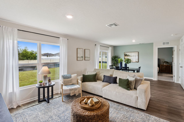 Living room and dining room with modern decor.