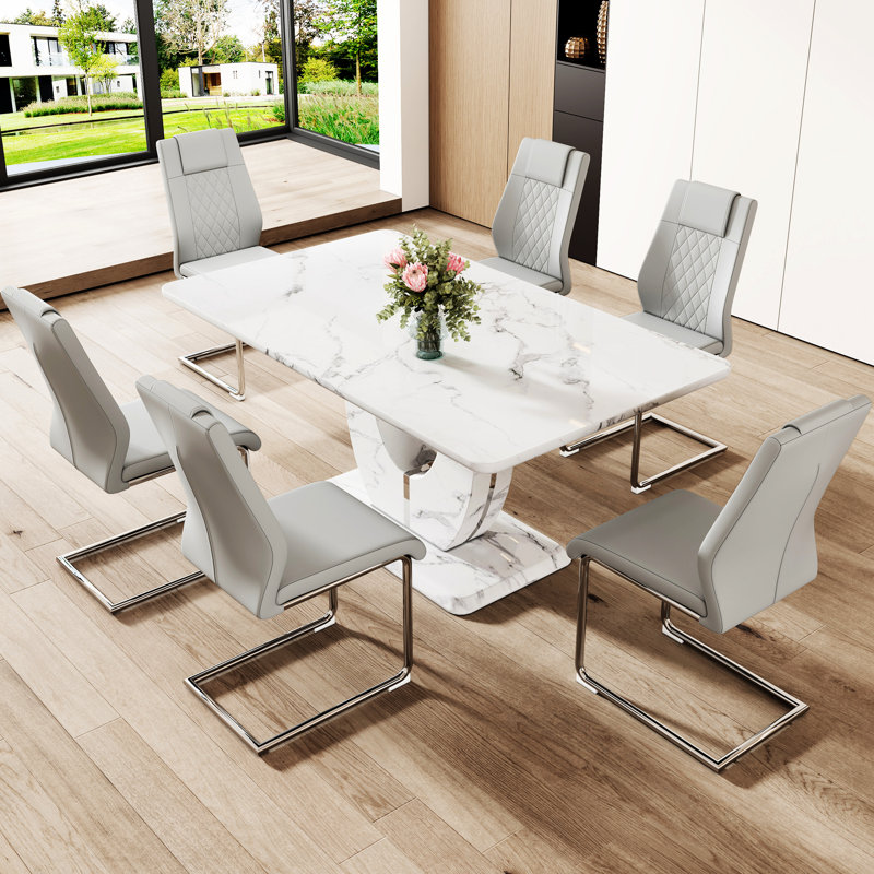 Table à manger en marbre convenant aux restaurants - table de 63 po x 37 po avec 6 chaises en polyuréthane grises, plateau de table épais, sièges confortables, pieds en métal argenté et chaise, autocollant texturé blanc, base