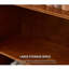 Bibliothèque entièrement sculptée en bois brun.