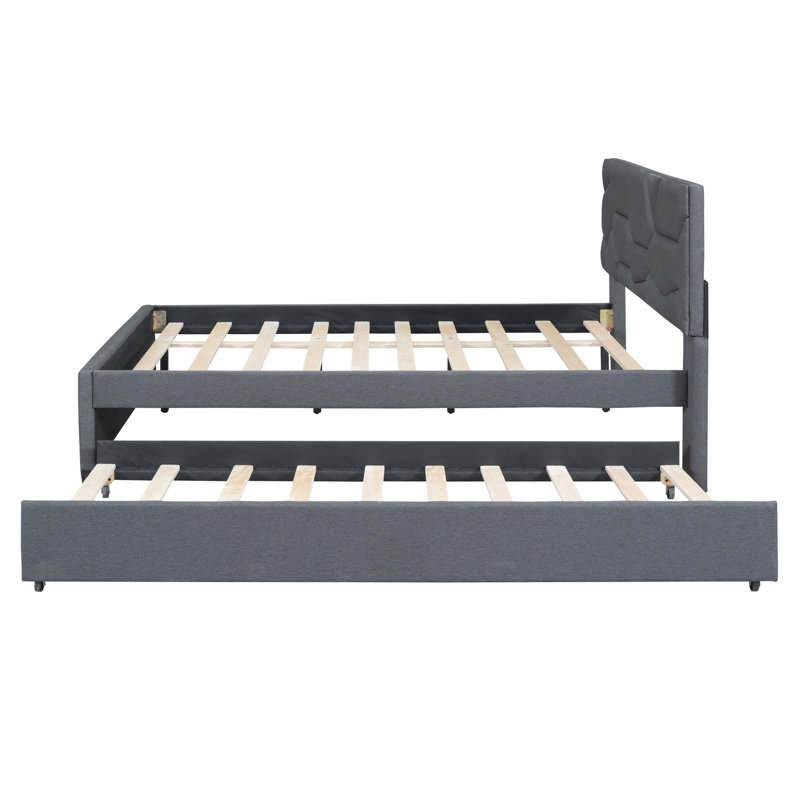 Lit plateforme tapissier avec tête de lit à motif brique et lit gigogne simple en lin gris pour une chambre à coucher relaxante