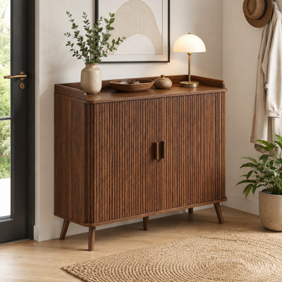 39.46-inch walnut wood sliding door shoe cabinet with adjustable shelves and a perforated bottom; floor-standing storage rack for apartment entryway hallway.