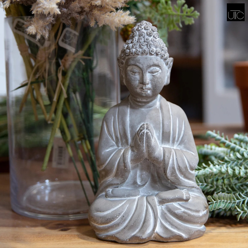 Figurine de Bouddha en prière