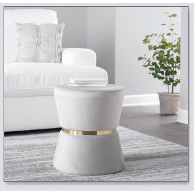 Contemporary Silver Velvet And Metal Ottoman, Perfect For Adding Glamour And Comfort To Any Living Space.