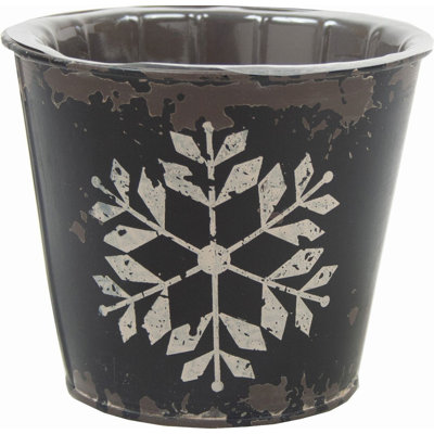 Boîte à fleurs noire antique avec flocon de neige blanc