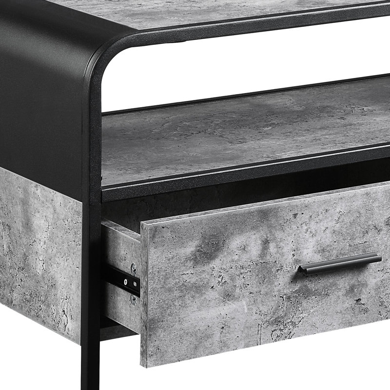 Meuble télé gris béton et noir avec structure métallique et compartiment de rangement pour téléviseurs de 39 pouces ou moins. Tiroir coulissant.