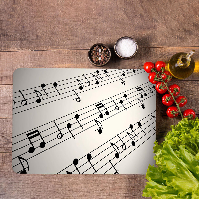Planche à découper à thème musical avec un musicien et des notes de musique sur un matériau en verre durable, idéal pour la cuisine et la préparation des aliments