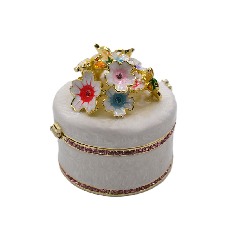 Boîte à bijoux ronde avec fleurs et papillons