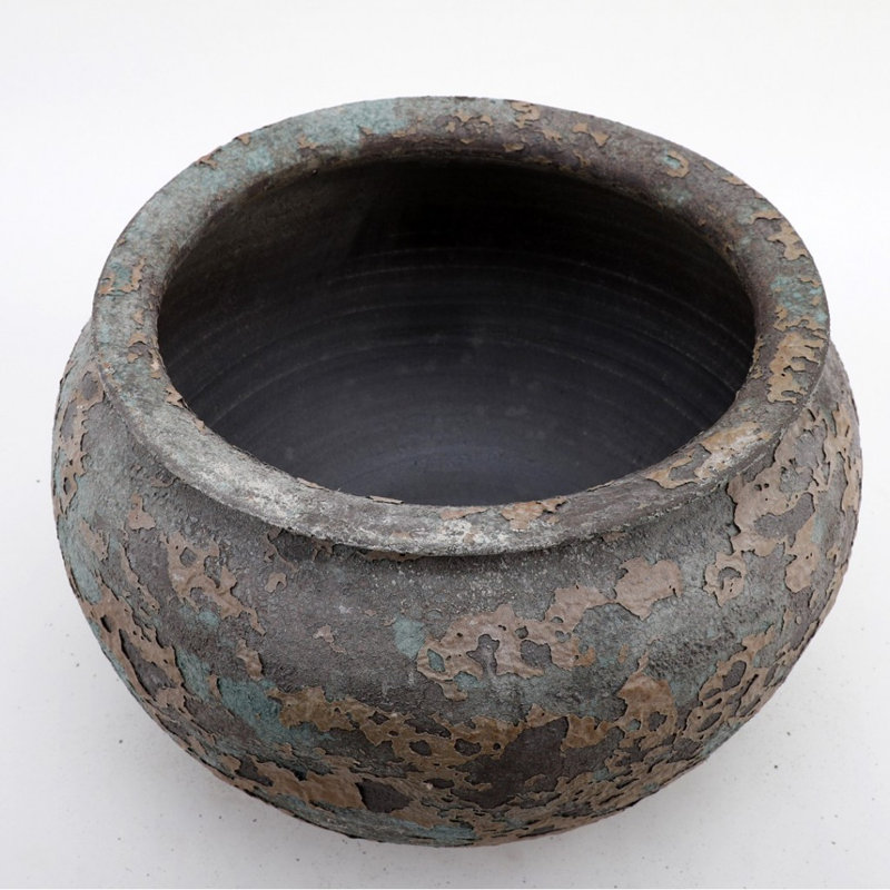 Poterie ronde en porcelaine émaillée