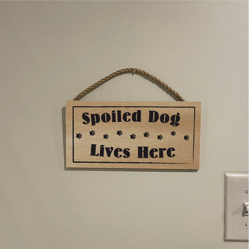 Panneau «Spoilé chien vivant ici»
