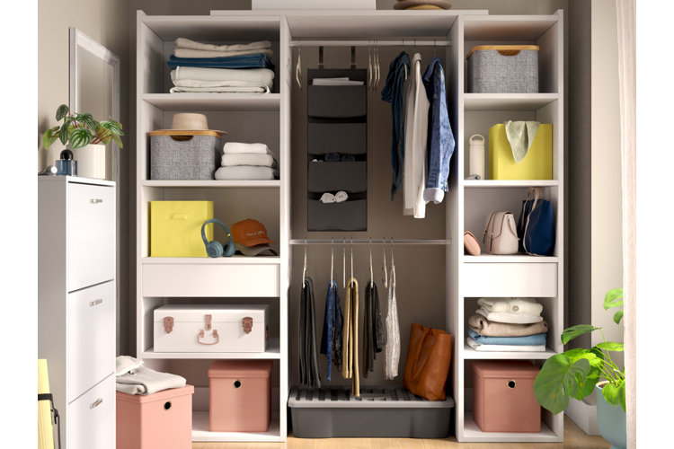 Walk-in closet with a structured closet system, storage baskets, and a hanging organizer.