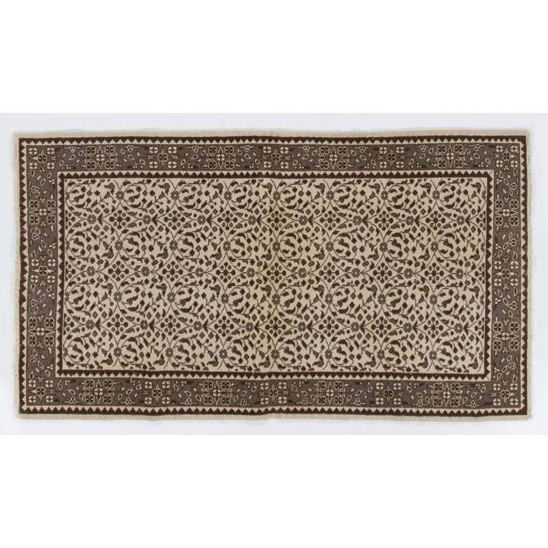 Tapis turc vintage à motif floral fait à la main. Revêtement de sol en laine