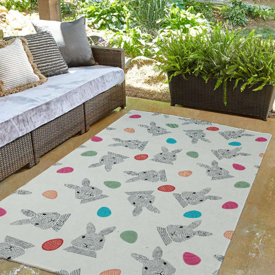 Tapis en chenille tissé à la machine Elioth en rouge / rose / vert