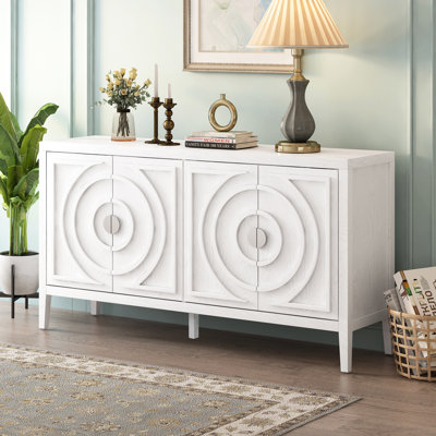Le buffet multifonctionnel blanc rétro, idéal pour organiser vos essentiels pour la maison avec des lignes arrondies et des poignées en métal, crée un look élégant