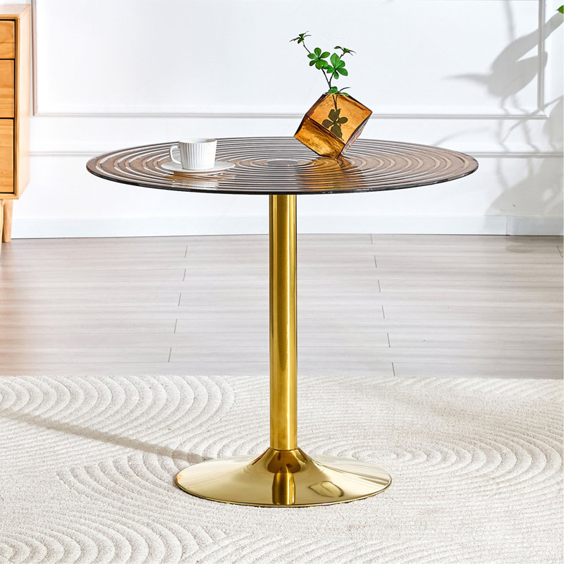 Table ronde en verre brun clair de 35 pouces de diamètre. Pilier en métal doré. Négociation, table basse de maison, table de salle à manger. Convient aux petits espaces repas de 2 à 4 personnes.
