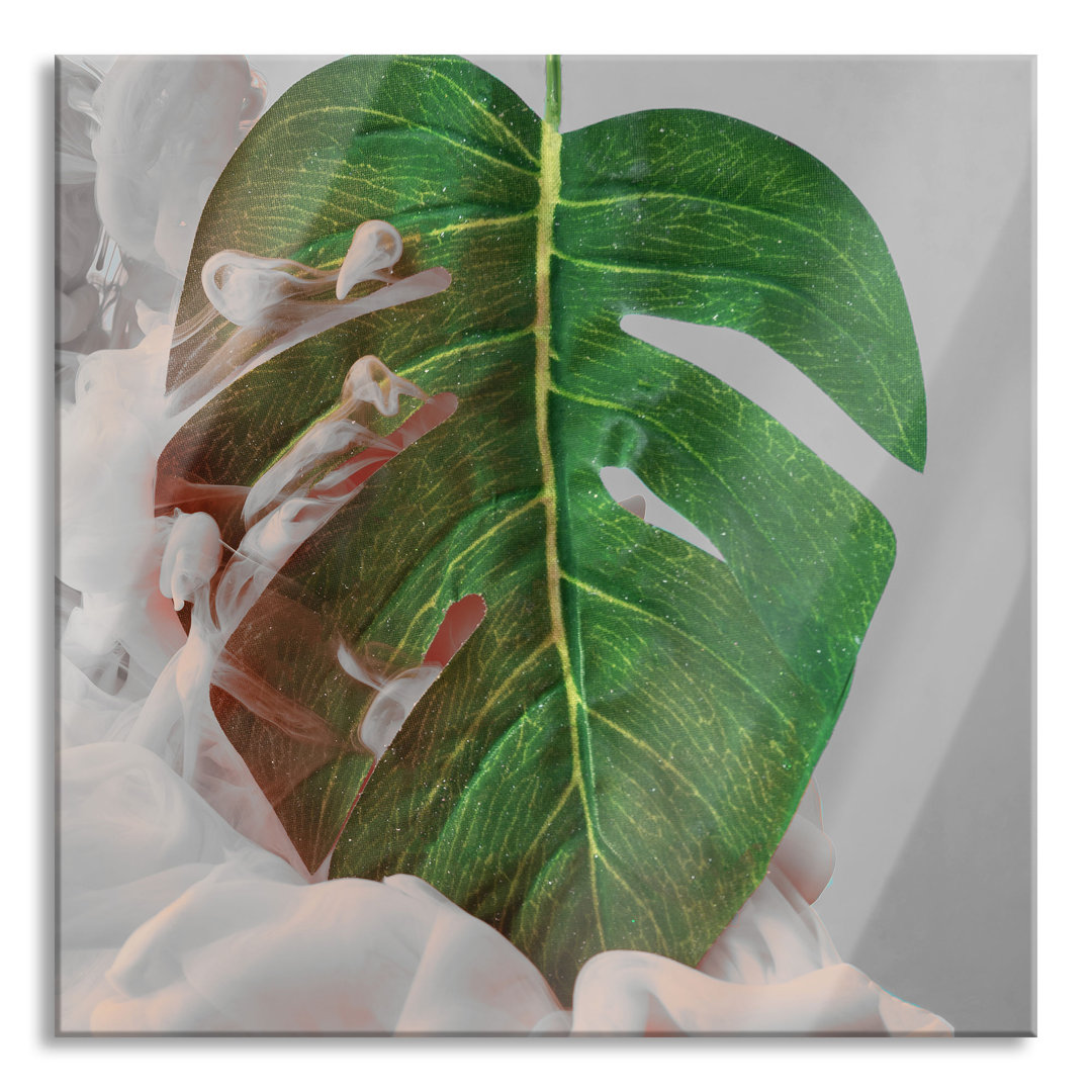 Glasbild Monstera Blatt mit Pastellwolke