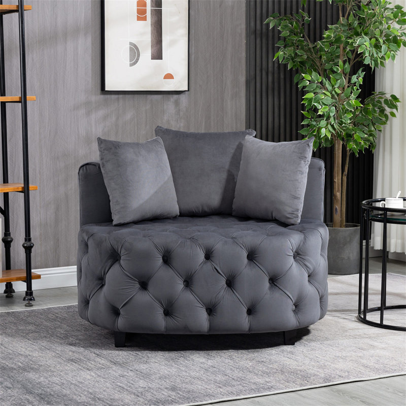 Élégante chaise d'appoint capitonnée pour le salon, confort moelleux et design élégant, parfaite pour les intérieurs modernes et classiques.