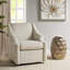 Fauteuil rembourré en tissu avec base ronde