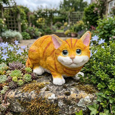 Resin figurine of a cute orange tabby kitten in a sleeping pose; weather-resistant yellow cat statue; a pet memorial ornament suitable for indoor and outdoor use.
