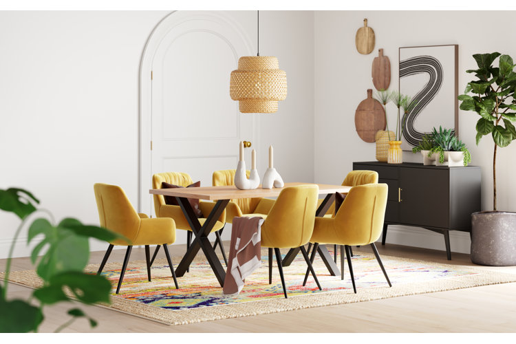 dining room with yellow chairs and a rattan chandelier