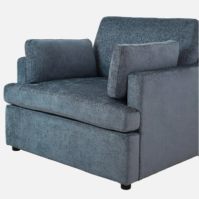 Fauteuil avec des coussins moelleux et une structure robuste, parfait pour la détente et ajoutant une touche d'élégance à n'importe quelle pièce.
