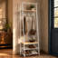 Portemanteau autoportant 4 en 1 pour vestibule, portemanteau avec tringle, tablettes de rangement pour chaussures et banc rembourré, panneau de particules avec structure en métal noir robuste-473896372