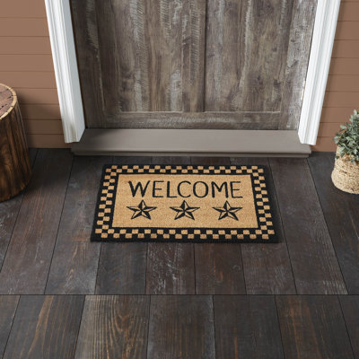 Tapis noir Welcome