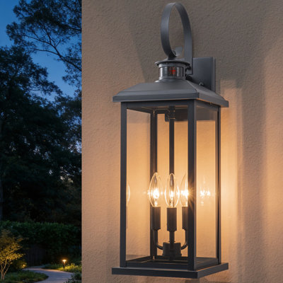23.5in. Oversize Black Motion Sensor Dusk To Dawn Outdoor Wall Lantern With Tempered Glass Shade