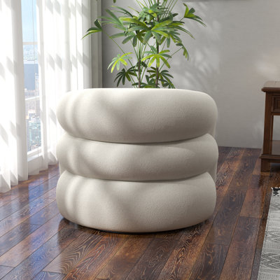 Fauteuil demi-tonneau pivotant rembourré Coyle