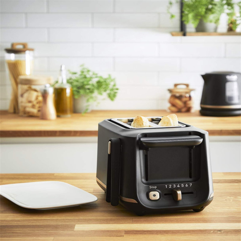 Toaster with 2 slots and magnetic clips, large controls, 7 browning levels, removable crumb tray, lifting function