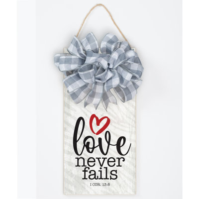 Love Never Fails Wood Plaque 13.625"x6.75"