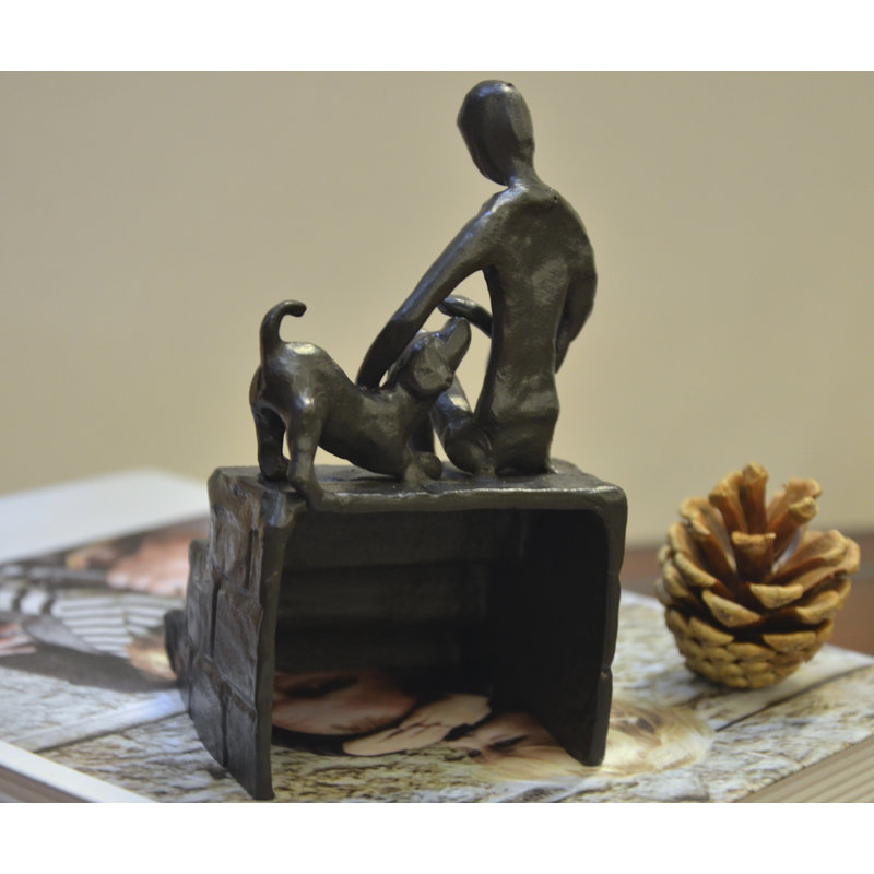 Figurine Dibiase homme caressant un chiot