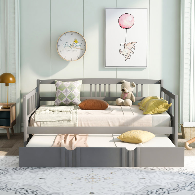 Versatile Wood Daybed With Trundle For Relaxation And Extra Sleeping Space, Ideal For Small Living Areas And Family Use.
