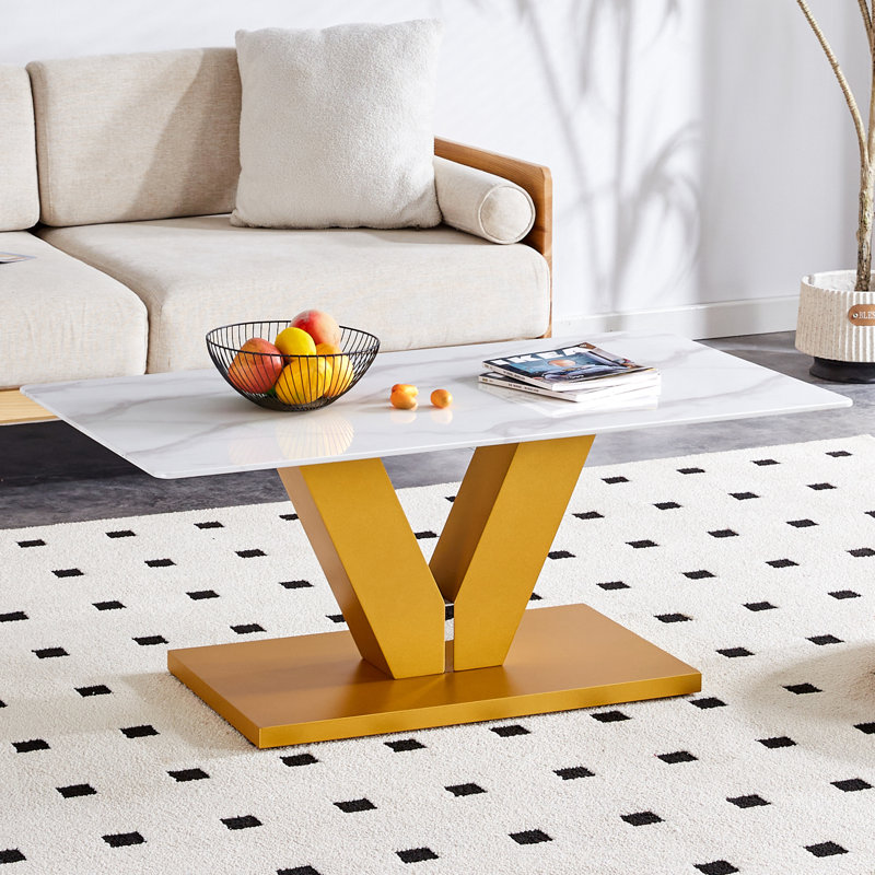 This Elegant Table Combines Durability With A Sleek Design- Featuring A Tempered Glass Tabletop With Stickers And Golden MDF Pillars, Perfect For Living Rooms And Dining Rooms