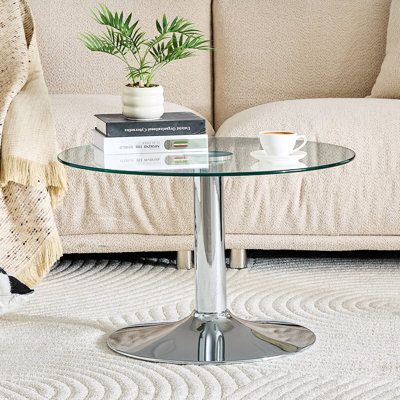 Table basse ronde en verre trempé de 27,5 pouces de diamètre. 17,7 pouces de haut, soutenu par une base en métal, avec un bord de luxe léger.