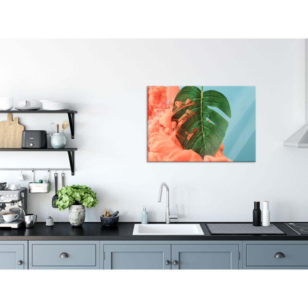 Glasbild Monstera Blatt mit Pastellwolke