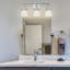 Éclairage pour salle de bain 3 lumières en acier et en verre de forme ovale 22,63 po Claremore-88626343