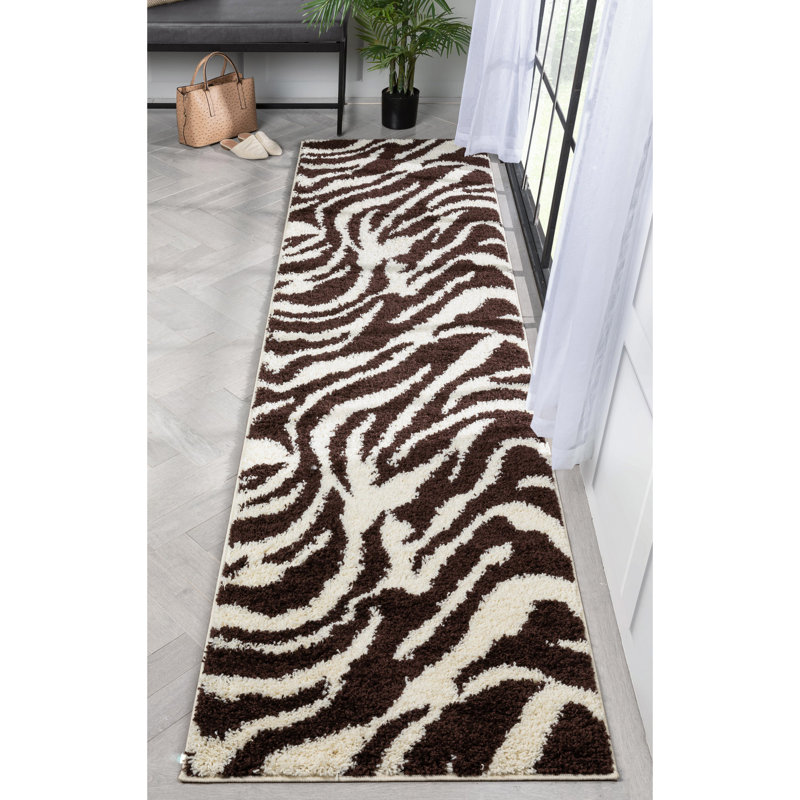 Tapis noir / blanc cassé à motif animalier Dondre