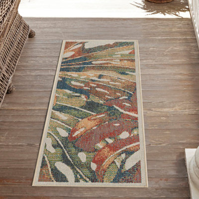 Tapis intérieur / extérieur vert / rouge à motif abstrait Tinesford