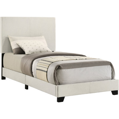 Twin Panel Bed In Cream Upholstery, Padded Headboard For A Comfortable Night, Rubberwood And Engineered Wood Composition, Black Solid Legs, Bedroom Centerpiece, Transitional Style, Box Spring